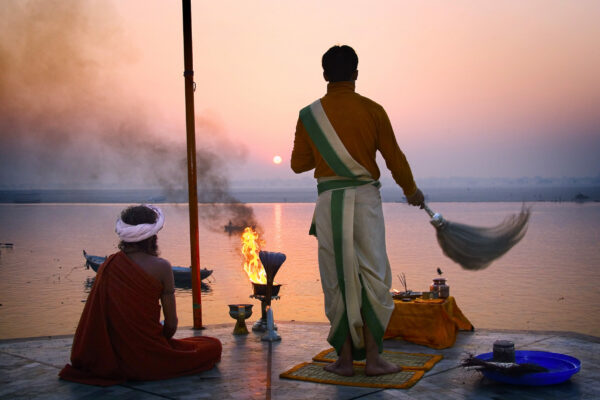 Hindi priest saluting the sun in the Ganges, Varanasi Benares India